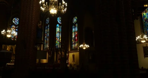 Stained Glass Windows and Brick Columns Inside Historic Church Stock Footage 336999846