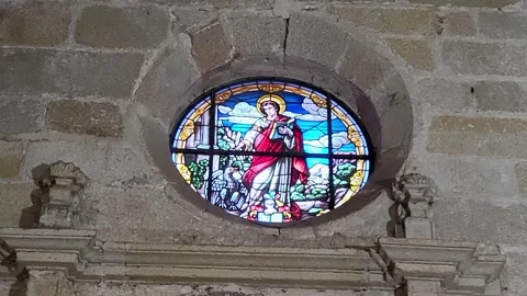 Stained glass windows and Gothic arches inside a medieval Spanish cathedral Stock Footage 327485228