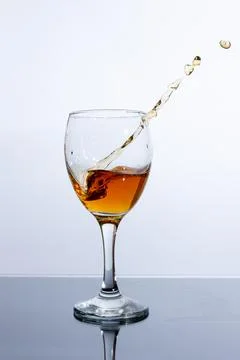 Staing splahing glass on light background Stock Photos