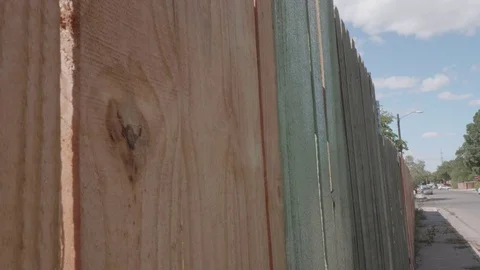 Staining Fence with Paint Roller Stock Footage 80163744