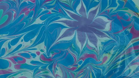 Staining objects with ebru technique. colored paints on water Stock Footage 140313823