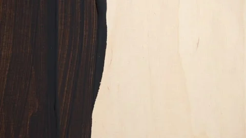 Staining wood board with dark brown paint and brush, close up 스톡 동영상 345815591