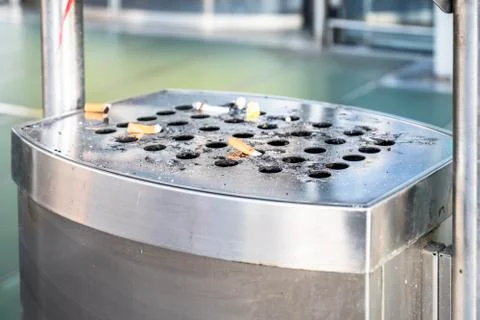 Stainless ashtray with cigarettes Stock Photos