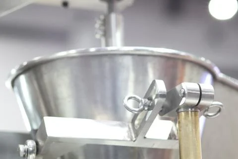 Stainless hopper is a part of machine for storage a Stock Photos
