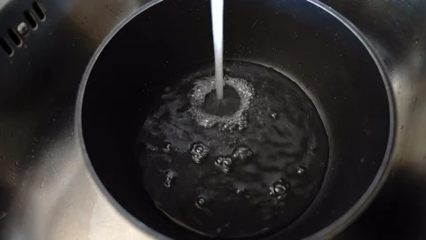 Stainless kitchen pan filled with clean water from the tap. Cooking pan lying in 스톡 동영상 122693563
