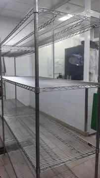The stainless Metallic rack view in the kitchen Stock Photos