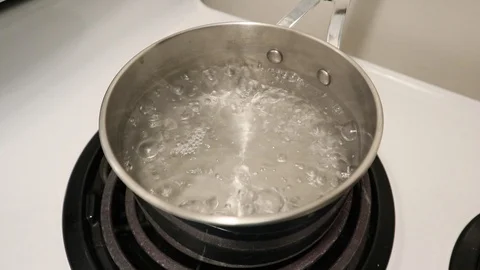 Stainless pot with boiling water Stock Footage 124719720