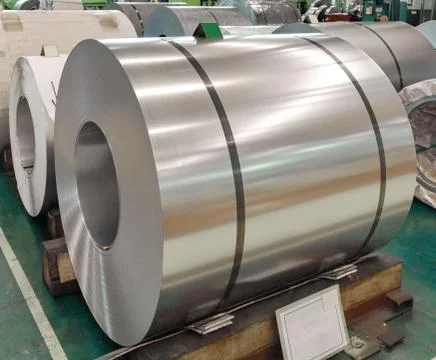 Stainless rolled steel sheet in coil in the factory warehouse area Stock Photos
