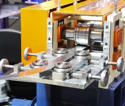 Stainless sheet exit from die in cold roll process ; Stock Photos