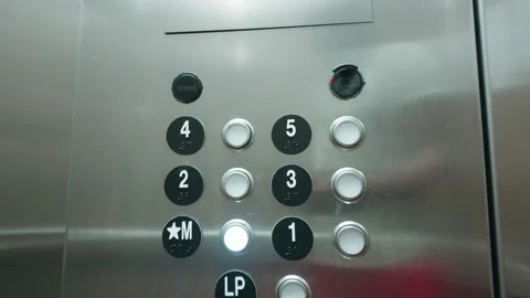 Stainless steel elevator button panel inside building elevator car Stock-Footage 342920311