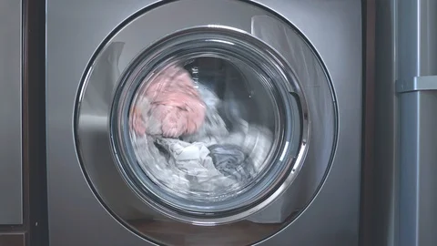 Stainless steel front loading washer close up Stock Footage 104921578