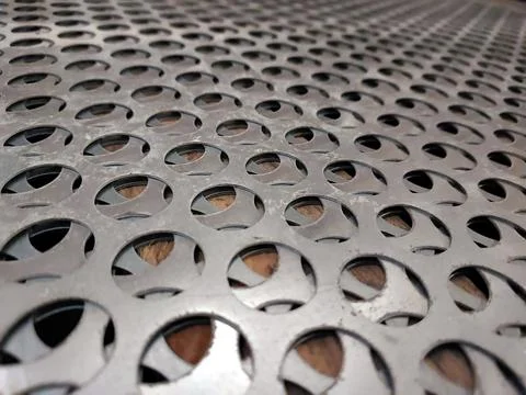Stainless Steel Mesh Pattern Showcasing Intricate Design and Texture Under .. Stock Photos