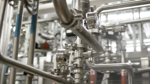 Stainless steel metal piping in dairy plant Stock Footage
