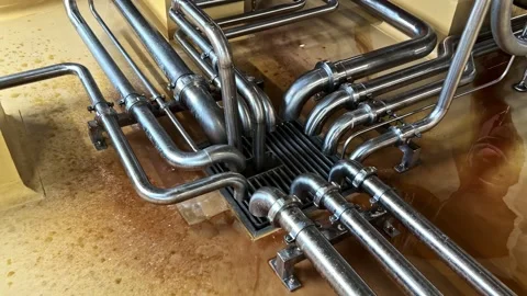Stainless Steel Process Pipes Above Industrial Floor Drain Stock Footage 341540169