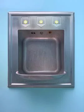 Stainless Steel Sink with Knobs on Blue Background Stock Photos