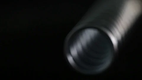 Stainless steel spring on bright background Stock Footage 83647238