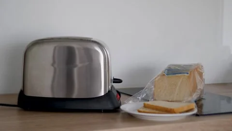 Stainless Steel Toaster with Sliced Bread on Kitchen Counter Stock Footage 317006008