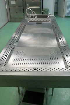A stainless steel work table for post-mortem procedures and dissection 写真素材