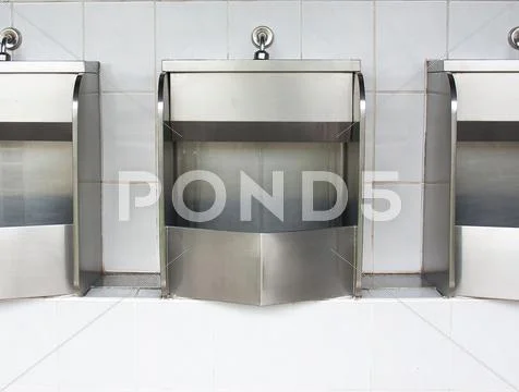 Stainless urinals Stock Photos