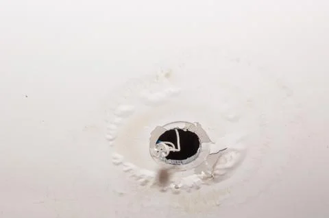 Stains on the ceiling a result of leaking rain water roof. House insurance. Stock Photos