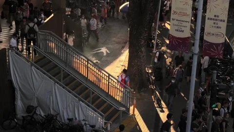Stair from a train station when sun is setting, cigarette bin with smokers 03 Stock Footage 254239717