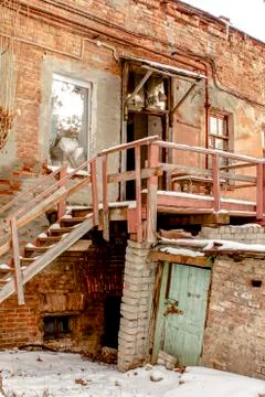 Staircase to climb to the second floor of an old brick building outdoors Stock Photos