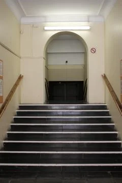 Staircase going up to a corridor Stock Photos