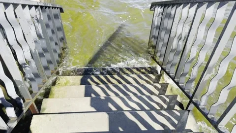 A staircase is shown with water splashing up from the steps Stock Footage 280450705