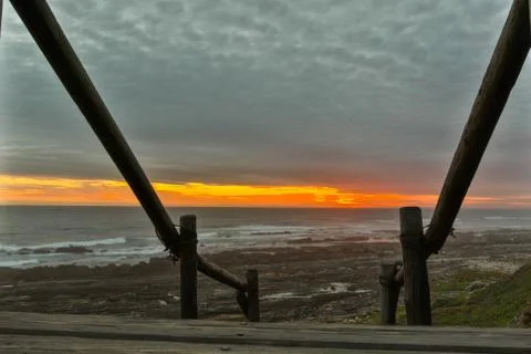 Staircase to the sunset in the background Stock Photos