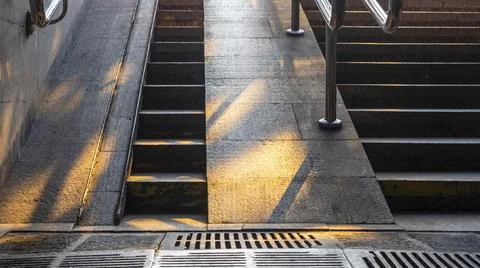Staircase in the underpass. Staircase to freedom. The rays of the sun on the  Stock Photos