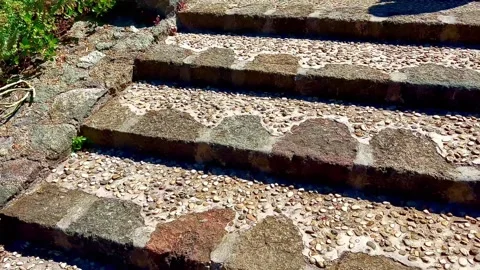 A staircase on which a nice pattern is laid out from small stones. Stock Footage 310764364
