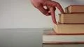 Stairs books, hand walking on HD Footage