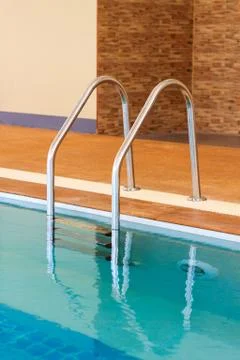 Stairs of the empty swimming pool Stock Photos