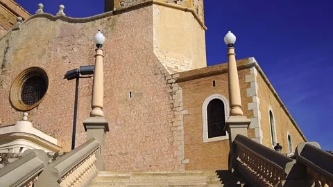 Stairs to get to Sant Bartomeu i Santa Teclala Parish Church in Sitges, Spain Stock Footage 263371736