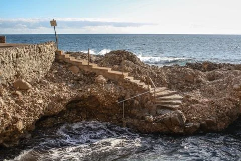 Stairs going down to water Foto stock
