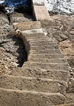 Stairs going down to water Stock Photos
