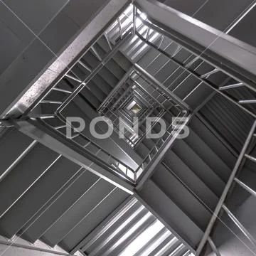 Stairs inside a building illuminated by lights Stock Photos
