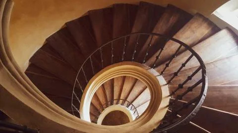 The stairs lead down in a circle. Stock Photos