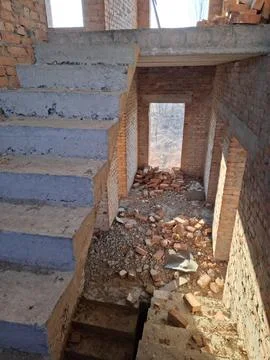 Stairs leading to second floor. The interior of an unfinished cottage Fotos Stock
