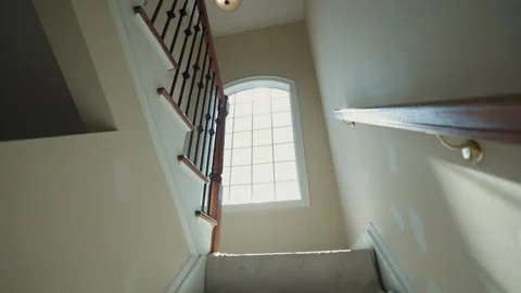 Stairwell Being Painted With Large Window, Interior Renovation in Natural Light Stock Footage 317442613