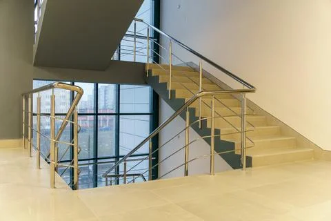 Stairwell in a modern building. An empty spacious hall with a flight of stair Stock Photos