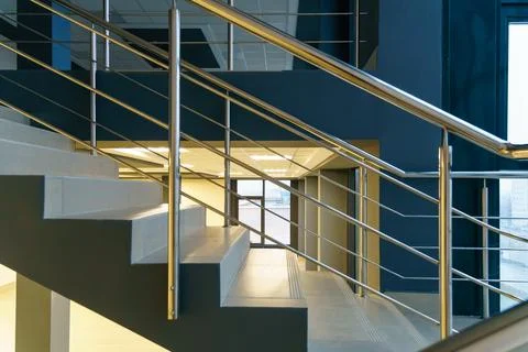 Stairwell in a modern building. An empty spacious hall with a flight of stair Stock Photos