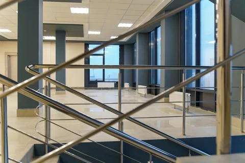 Stairwell in a modern building. An empty spacious hall with a flight of stair Stock Photos