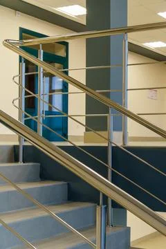 Stairwell in a modern building. An empty spacious hall with a flight of stair Stock Photos