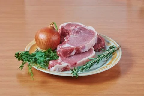 Stake onions and a green grass on a dish 스톡 사진