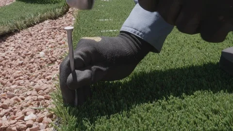 Staking Down Astroturf Stock Footage 130164713