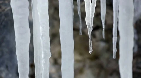 Stalactite ice ( icicles ) melting and drops, Stock Footage 54099286