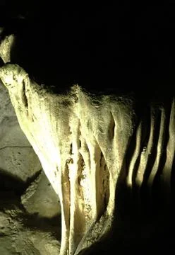 A stalactite in the shape of a dragon's tooth. Stock Photos