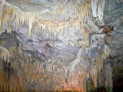 Stalactites, dripstones at the ceiling of cave. Stock Photos