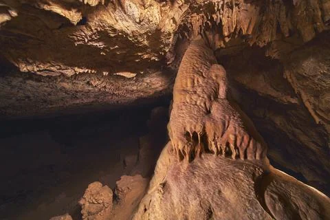 Stalagmite and Cavern Ceiling in Dramatic Light Painting Underground Cave Scene Stock Photos
